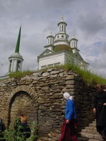 Pilgrims walking into the crypt under the Holy Trinity Church